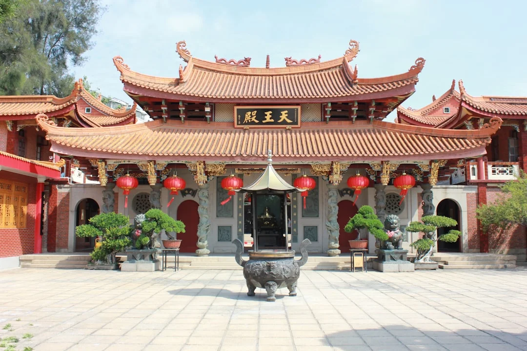 Traditional chinese temple with ornate roof and courtyard.
